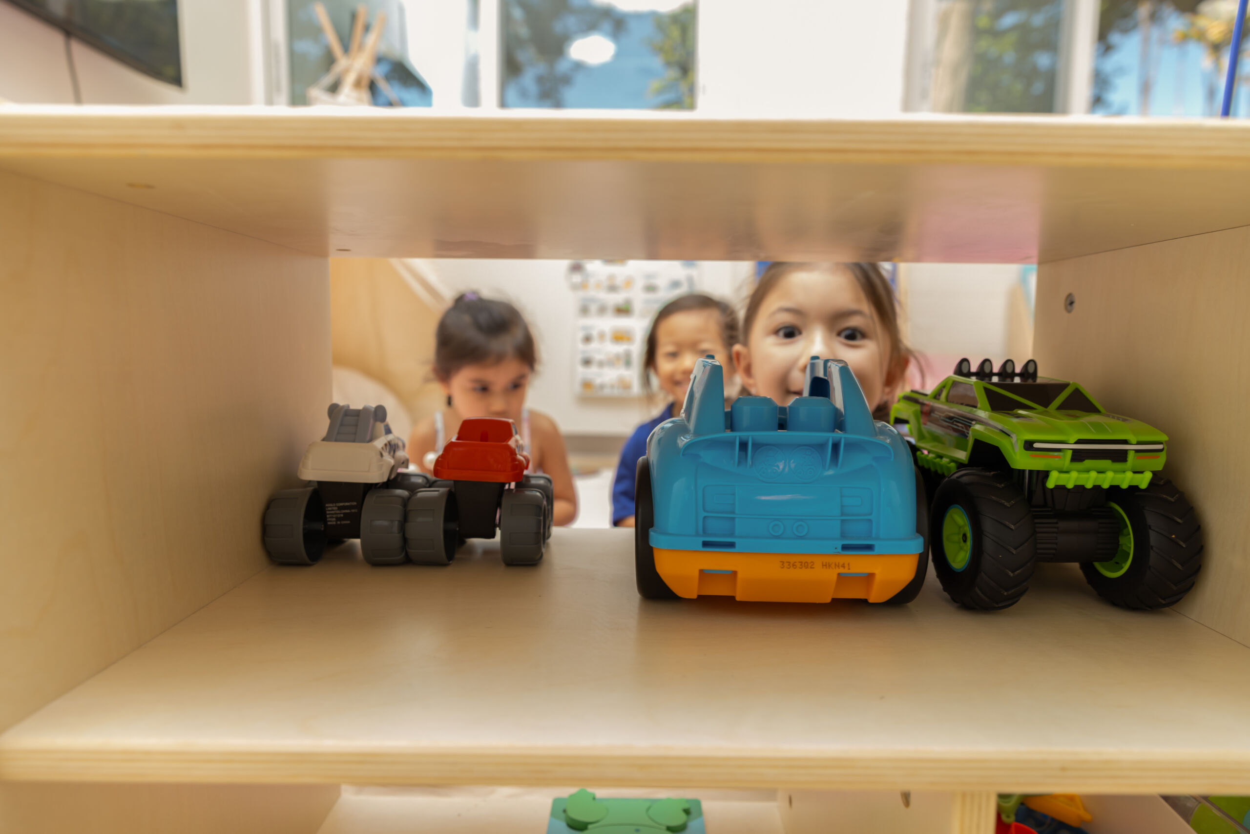 Early Achievers Preschool Hawaii children playing with toys in a classroom, supporting shy and anxious children through safe, engaging preschool activities