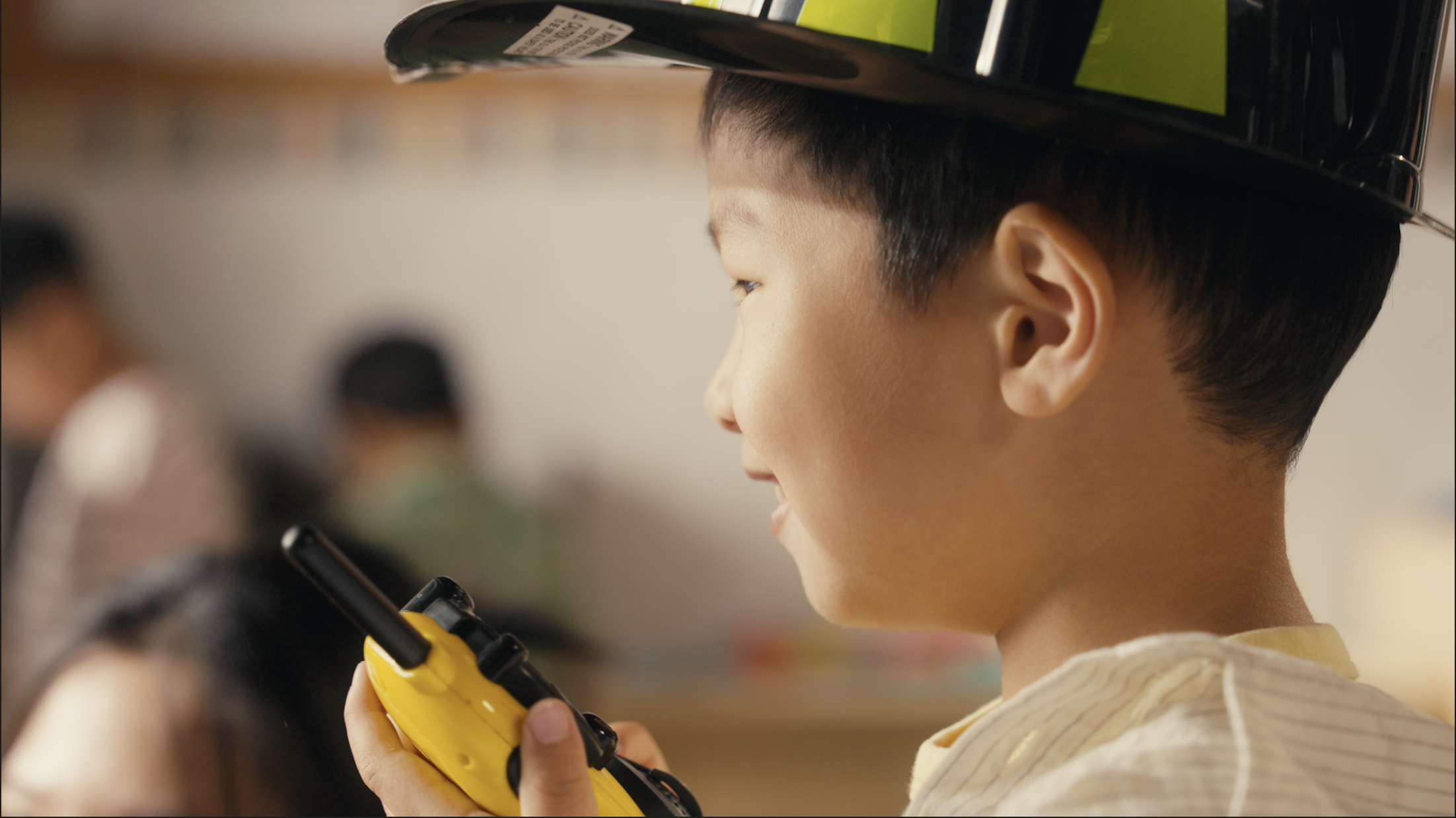 Preschool student engaged in role-play activity at Early Achievers Preschool Hawaii, nurturing confidence and social skills in shy children